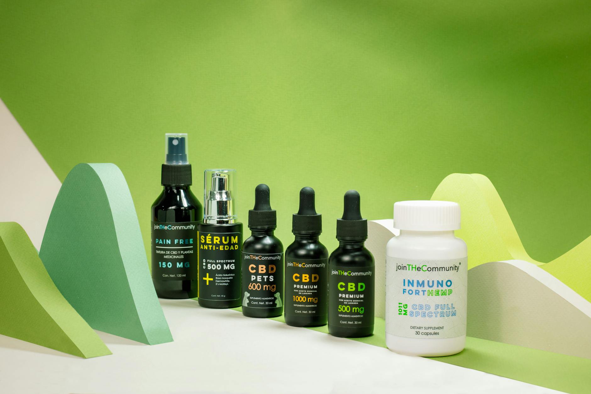 CBD product lineup with abstract green shapes, featuring oils and supplements. (Photo by Saul Rivera on Pexels)