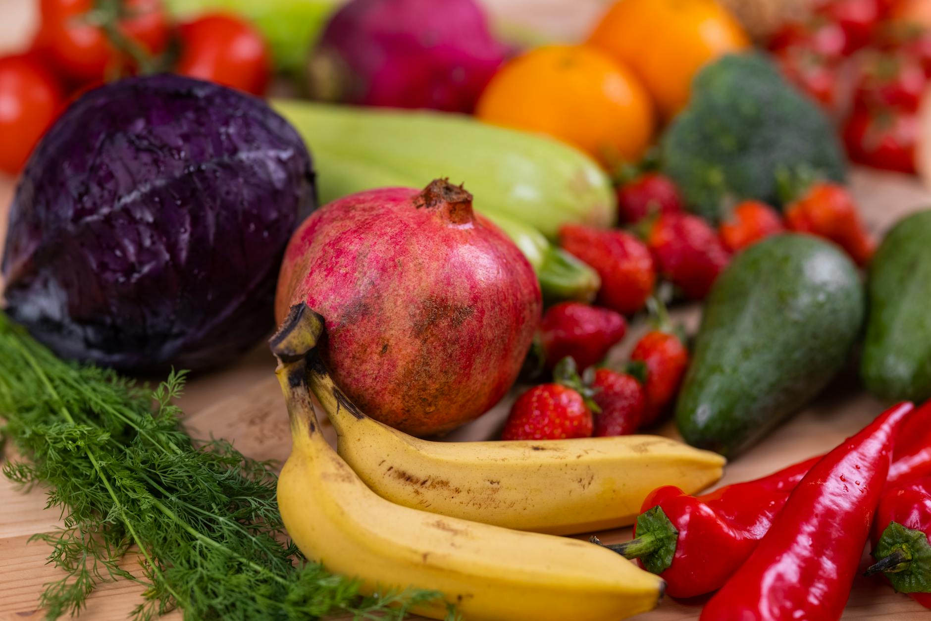 A variety of fresh fruits and vegetables arranged beautifully on a wooden table, showcasing natur... (Photo by Engin Akyurt on Pexels)